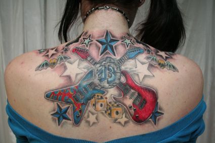 Guitar And Star Tattoo On Back